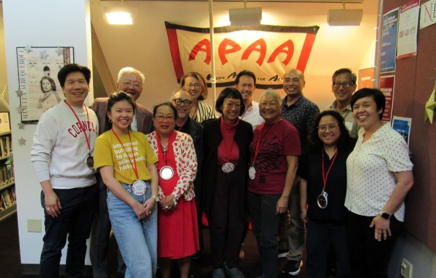 a group of people smiling in the AASP library